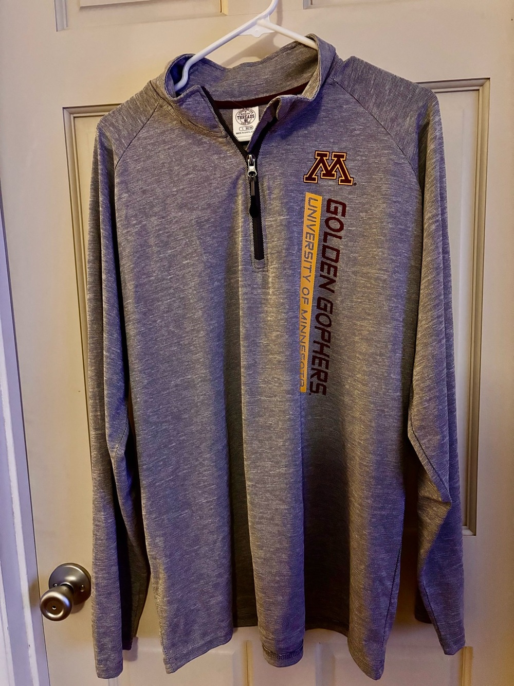 Minnesota Golden Gophers athletic quarter-zip pullover featuring vertical text